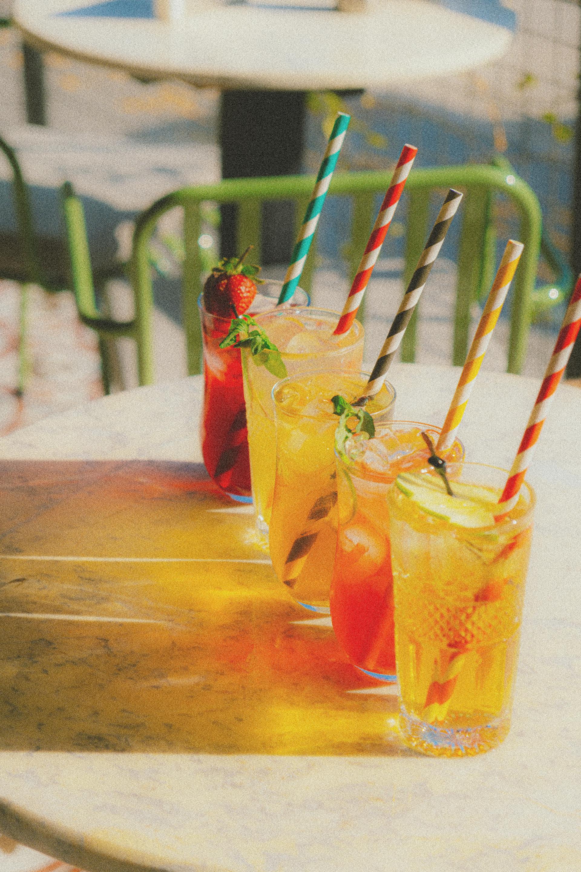 Variety of Colorful Summer Drinks with Straws